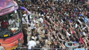 RCB Victory Parade 2025: Fans cheer as the bus carrying Royal Challengers Bengaluru cricketers in Bengaluru.(AP)